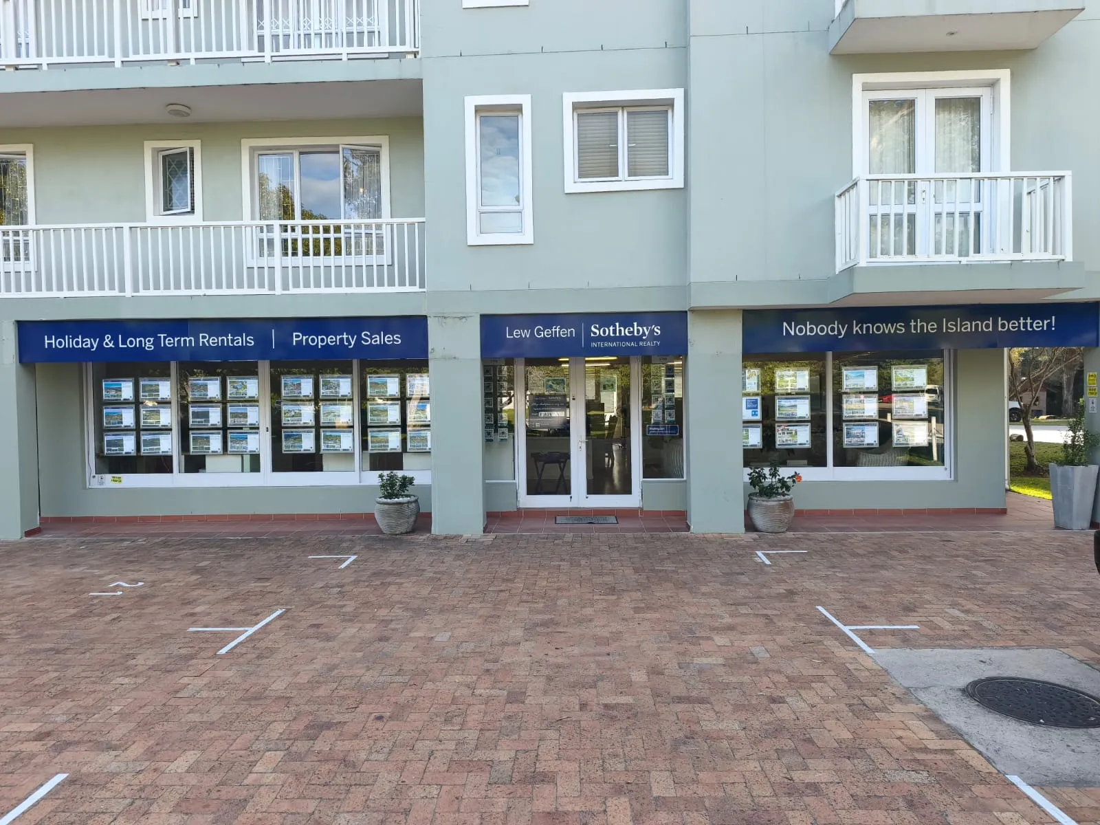 Lew Geffen Sotheby's — Full Storefront by Day