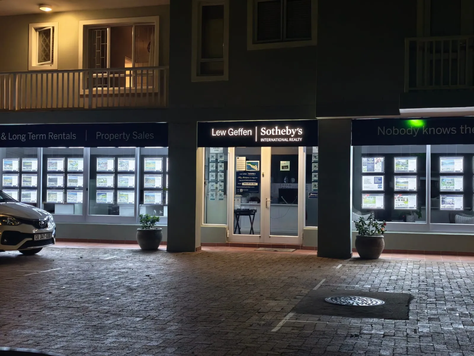 Lew Geffen Sotheby's — Full Storefront Illuminated