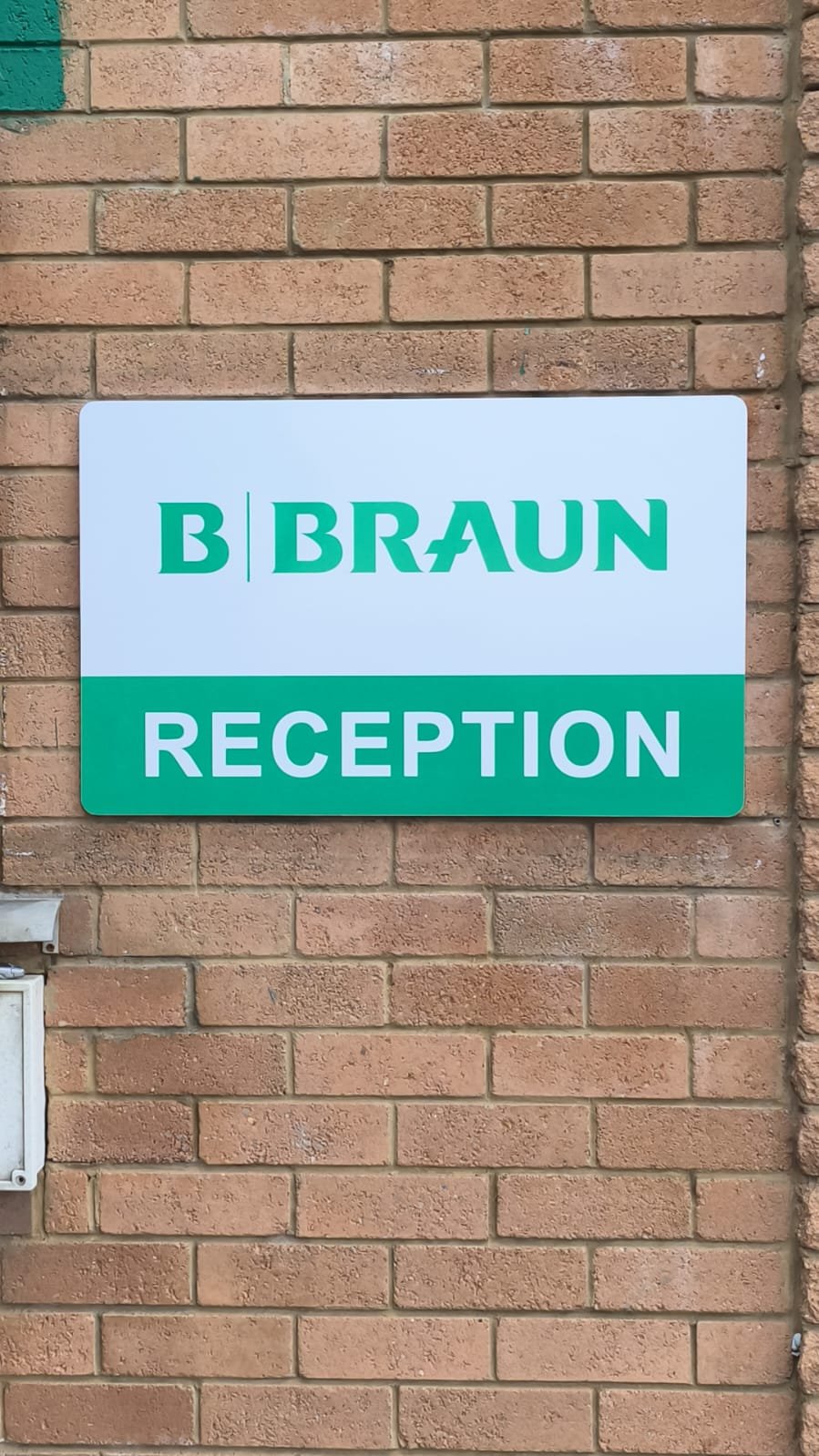 Interior reception wayfinding signage in a commercial building